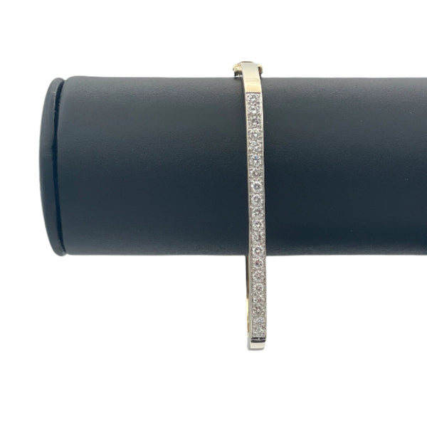Lovely 14k hollow yellow gold and diamonds bangle bracelet. This bangle attaches with a slide clasp.
