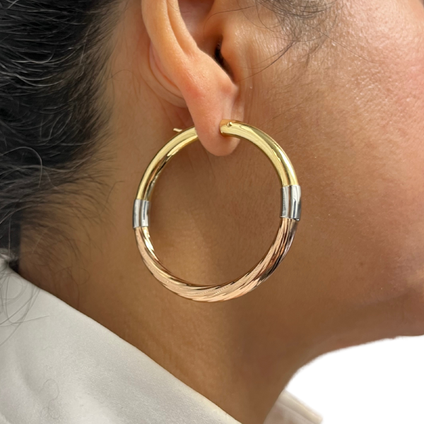 Large 18k hoop earrings worn by model